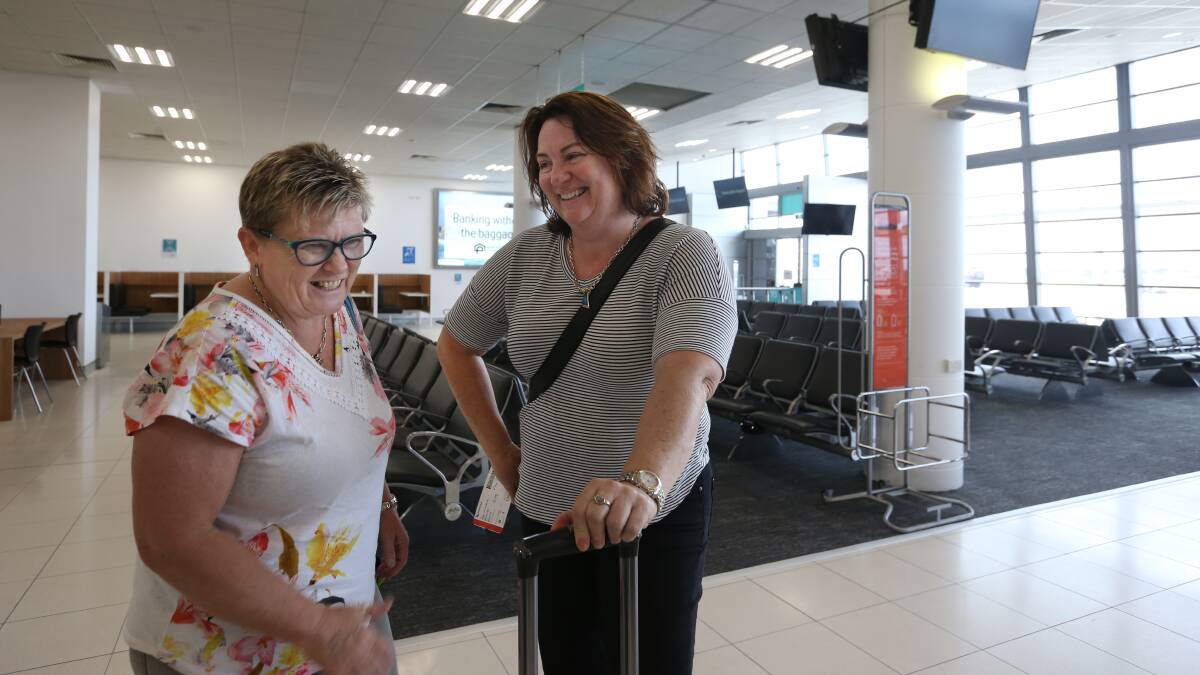 UP AND AWAY: Michelle Cheers and Julia Jones prepared to board their flight to Brisbane. Picture: Simone De Peak 