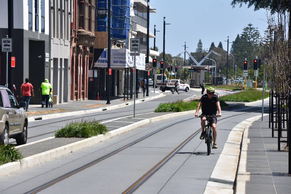 NO DEDICATED PATH: A cyclist on Scott Street. The NSW government was widely panned for not constructing a cycleway as part of the light rail project. Picture: Max McKinney
