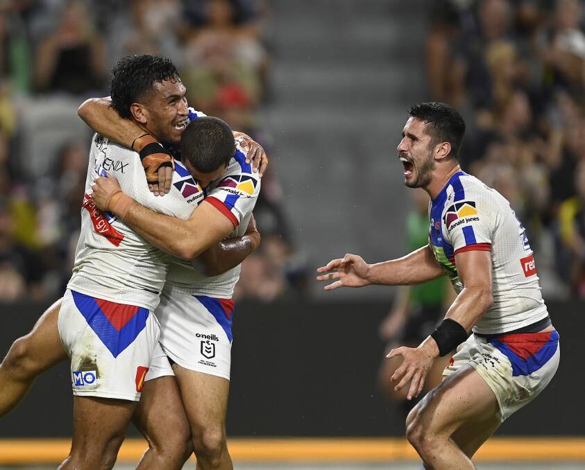 TAKING THE LEAD: Knights players celebrate after Jacob Saifiti's try in the first half. Picture: Getty 