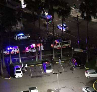 INCIDENT: Police and NSW Ambulance officers on King and Steel streets near the McDonald's restaurant in the early hours of Sunday morning. Picture: Supplied