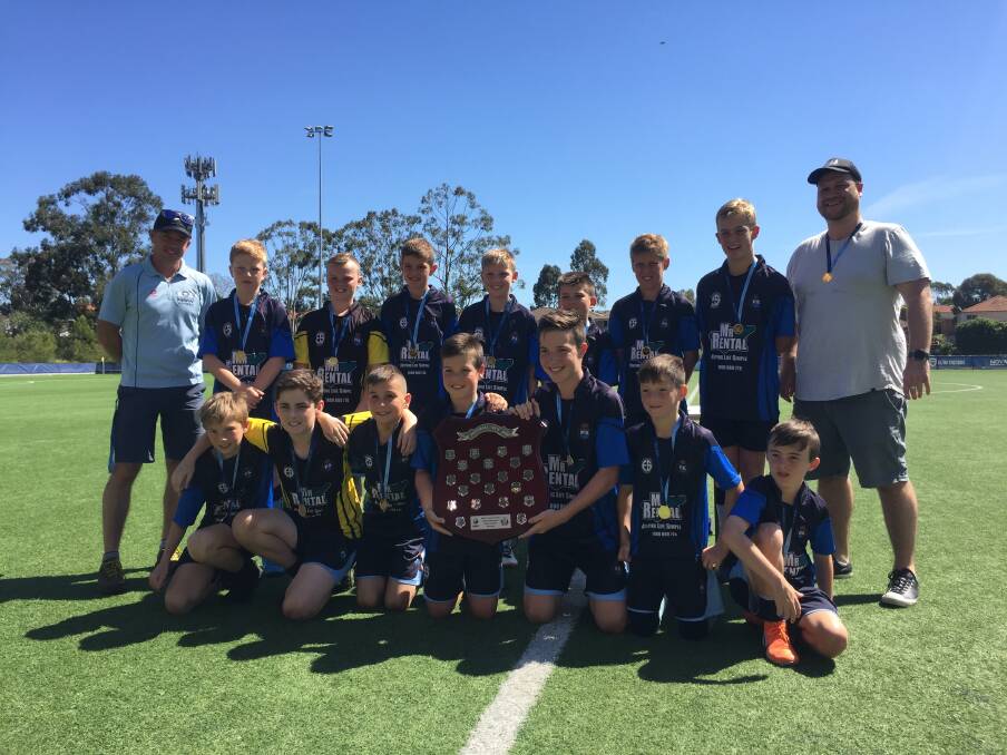 CHAMPIONS: The Floraville Public School boys soccer side after winning the state knockout grand final last week in Sydney.