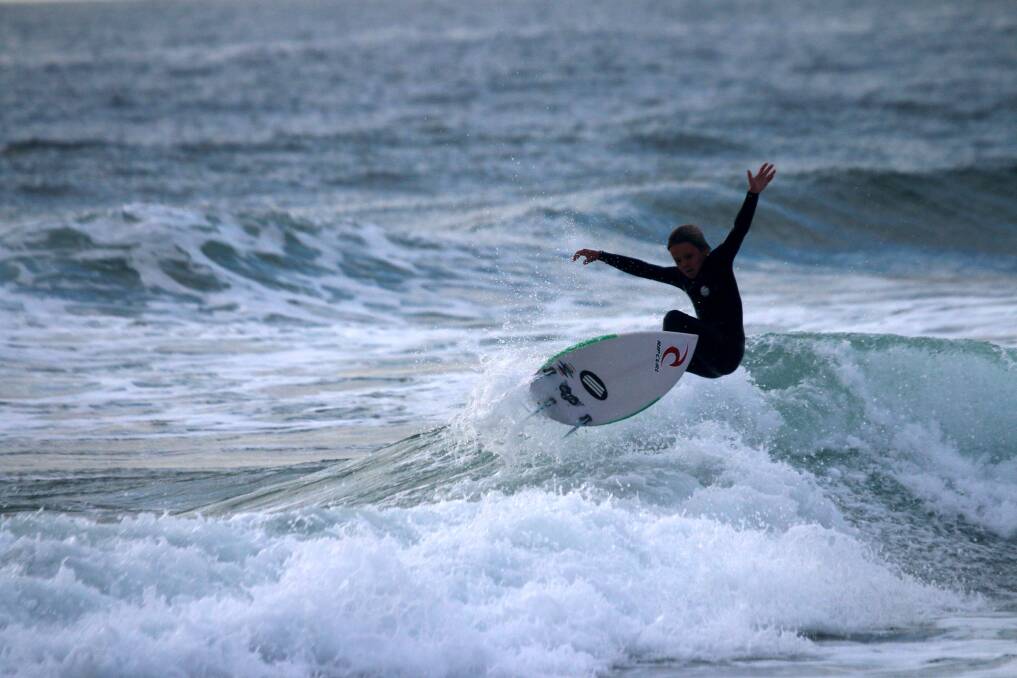 AIRTIME: A surfer in Newcastle on Monday. Picture: Dave Anderson