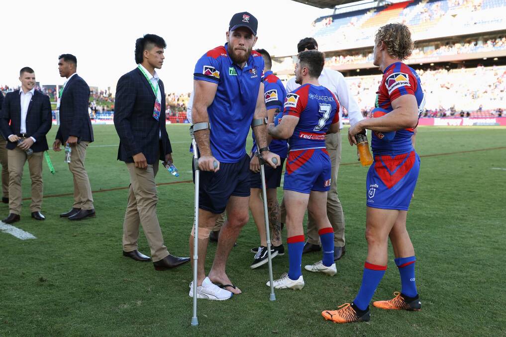 DOWNCAST: An injured Fitzgibbon after the Knights' round-two win over Wests Tigers. Picture: Getty Images