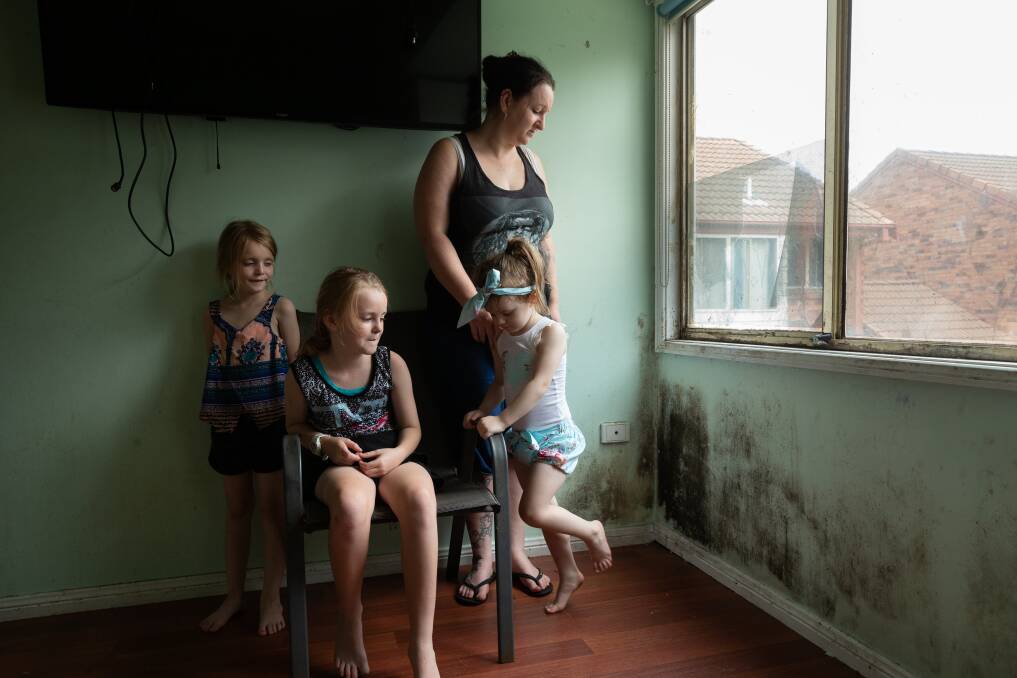 FED UP: Kylie March with three of her children inside the family's Carrington home. Pictures: Max Mason-Hubers