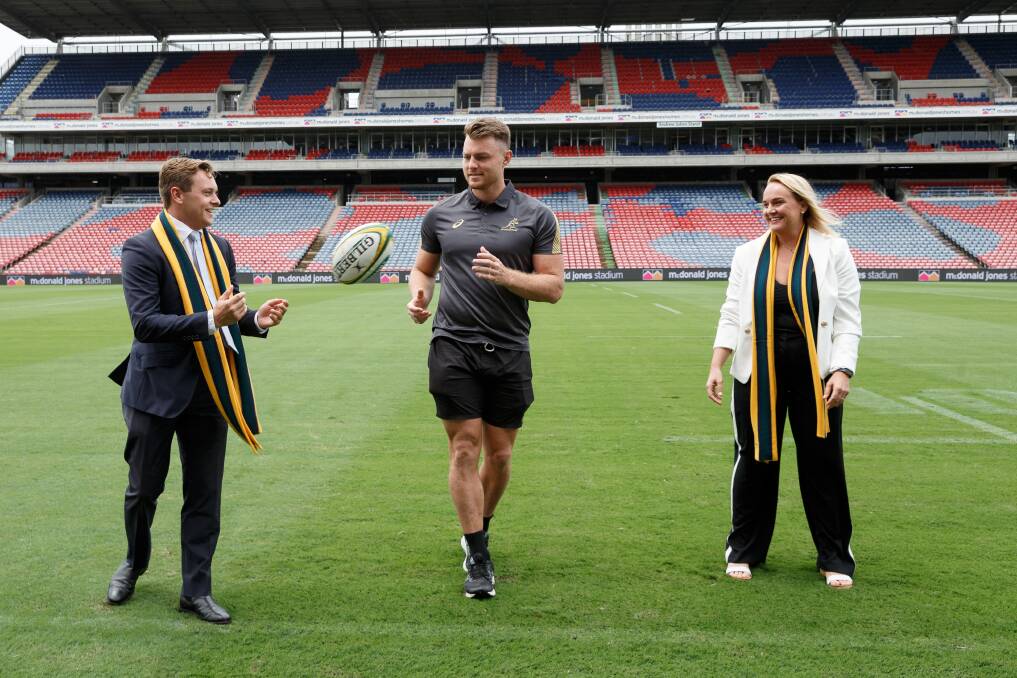 BENEFITS: NSW Liberal MLC Taylor Martin, Wallabies and NSW Waratahs player Jack Dempsey, and Newcastle lord mayor Nuatali Nelmes at McDonald Jones Stadium on Friday to promote the Wallabies match against Argentina in September. Picture: Max Mason-Hubers