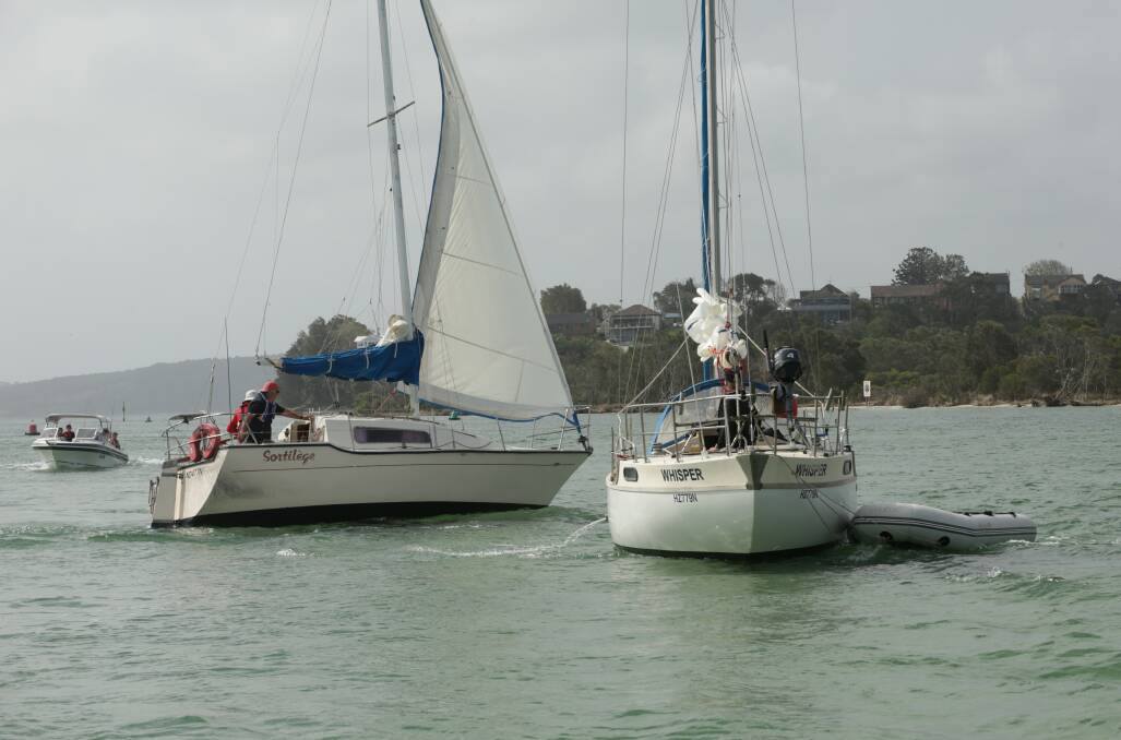 STUCK: Two yachts stranded near Swan Bay on Monday. Picture: Simone De Peak
