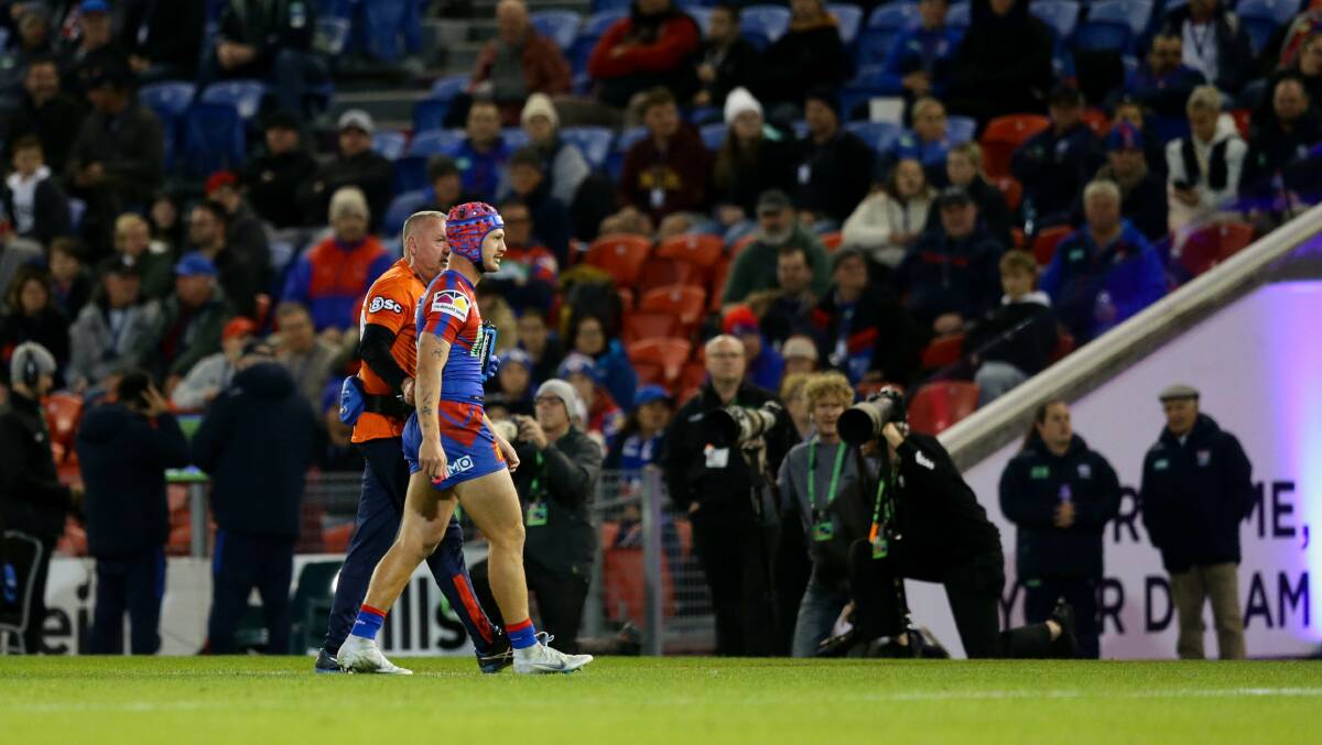 HEAD KNOCK: Ponga leaves the field on Friday night. Picture: Jonathan Carroll