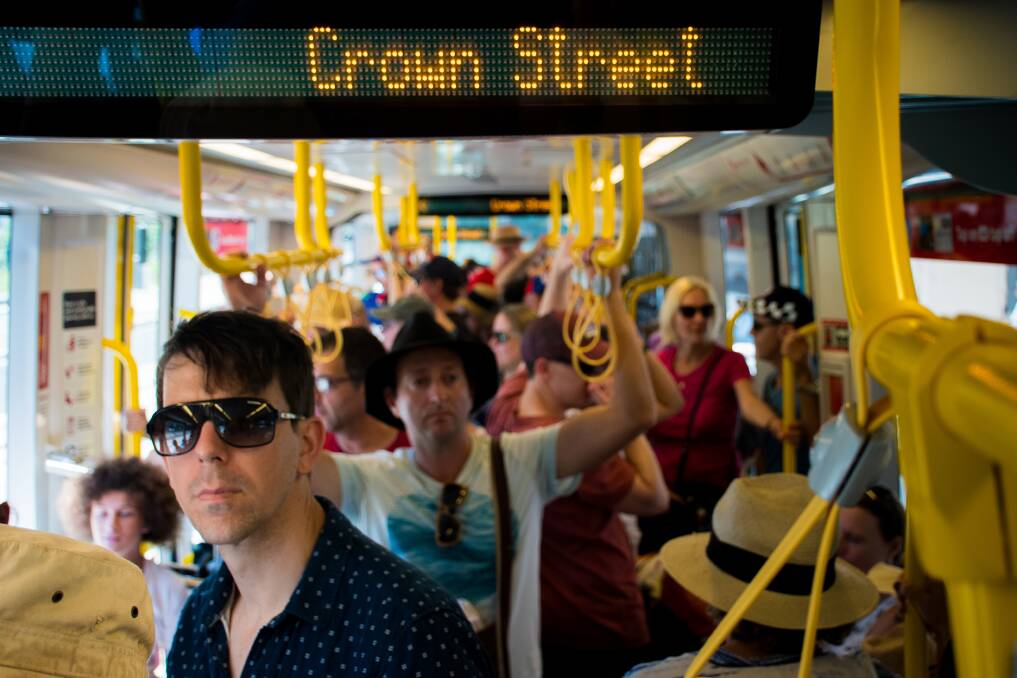 ALL ABOARD: Light rail launched with a bang last February. Pictures: Simon McCarthy