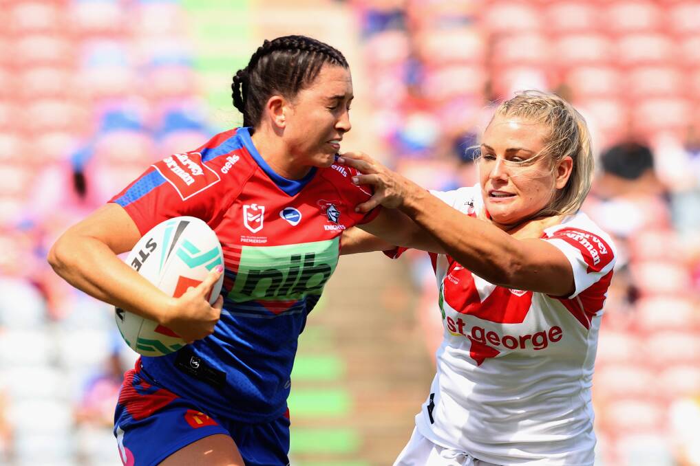 TOUGH DAY: Knights fullback Romy Teitzel tries to avoid being tackled during her side's loss to the Dragons on Sunday. Picture: Getty Images 