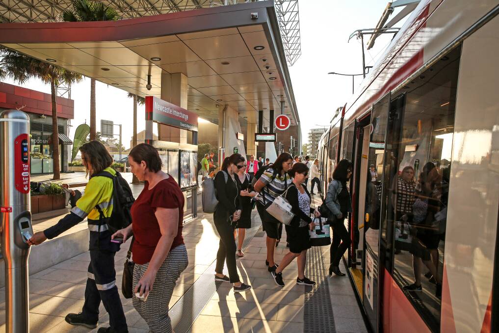 BUSY: Light rail passengers on the opening day. Picture: Marina Neil