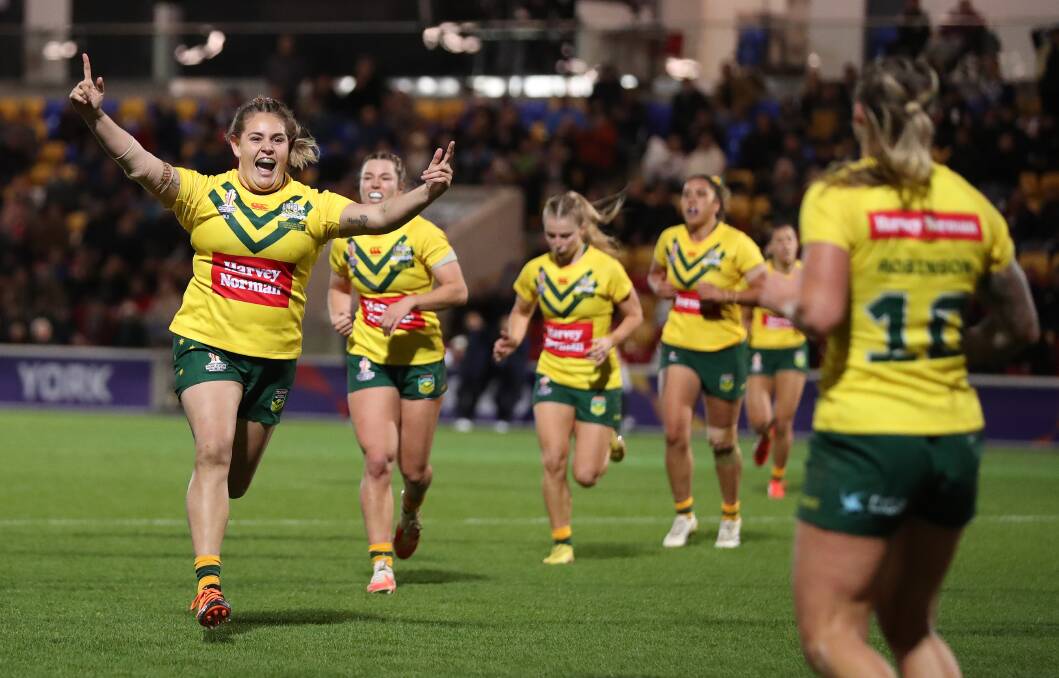 Jillaroos prop Caitlan Johnston celebrates a teammate's try. Picture Getty Images 