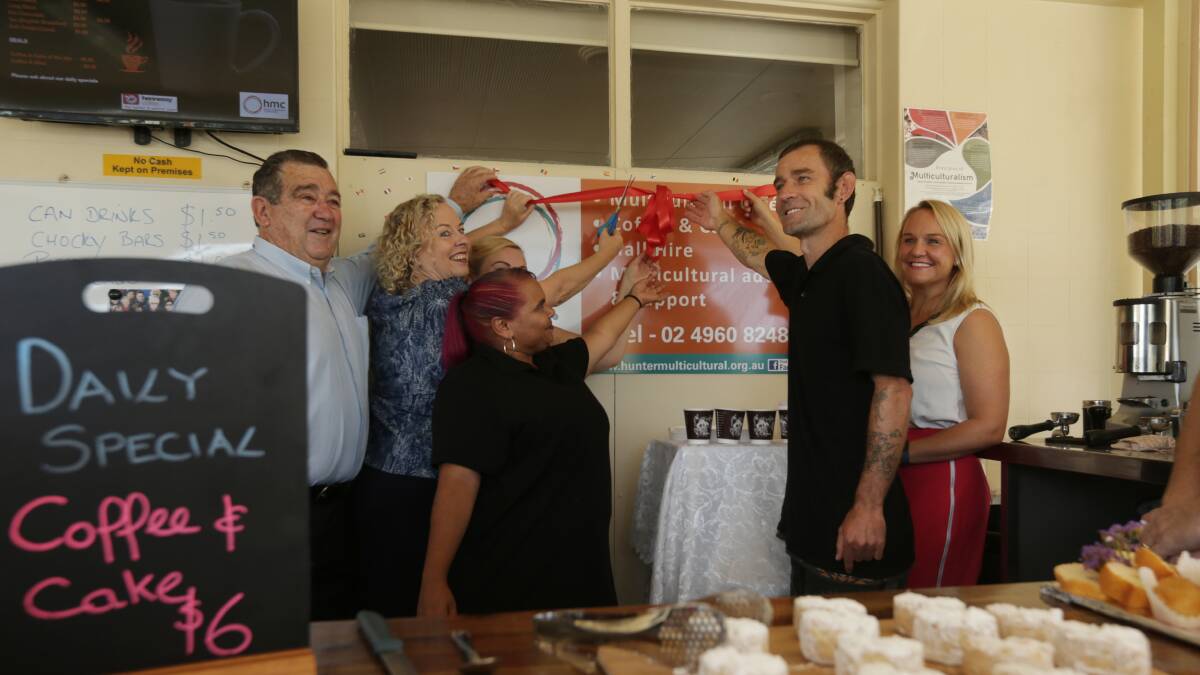 LAUNCH: A ribbon is cut to officially open the cafe. Picture: Simone De Peak