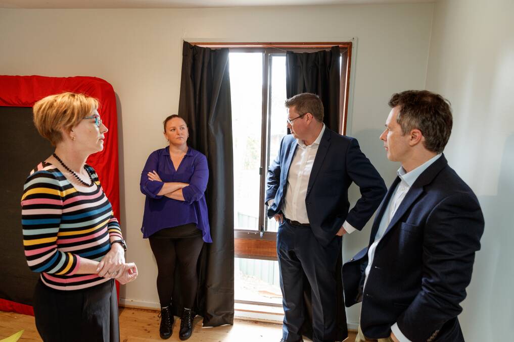 CONCERNED: Jodie Harrison, Pat Conroy and Jason Clare chat with Casie-Ann Martin, second from the left, at her social housing home in Windale on Friday. Picture: Max Mason-Hubers