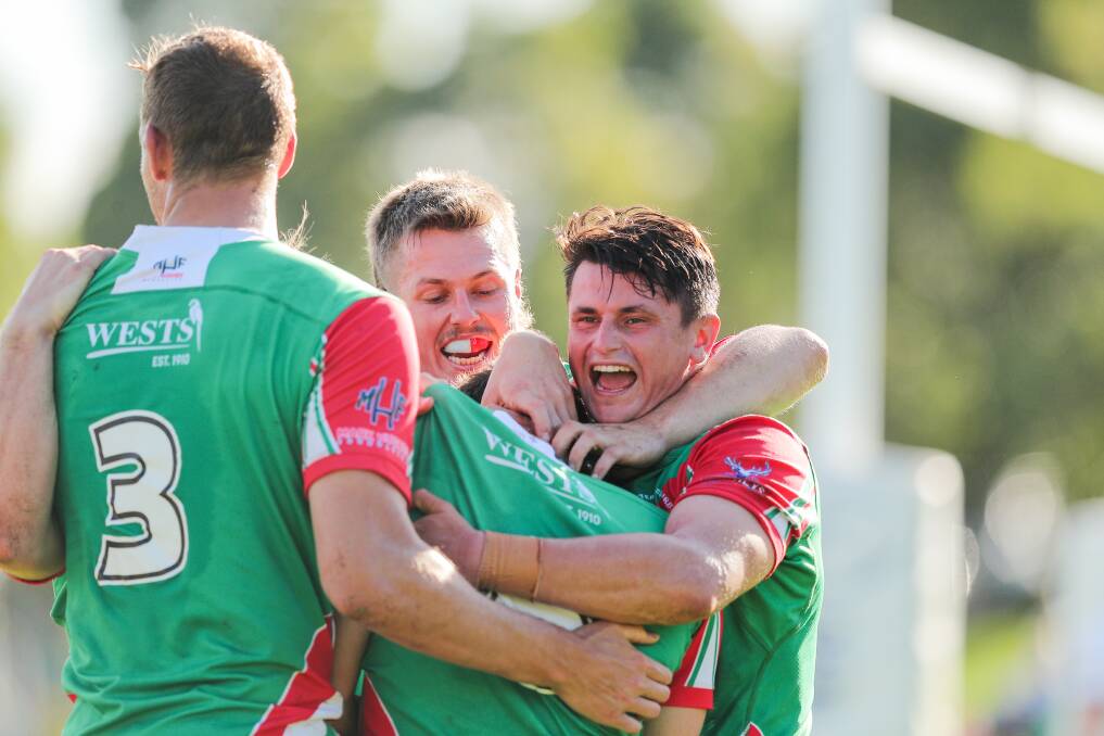 CELEBRATIONS: Wests Rosellas players. Picture: Max Mason-Hubers