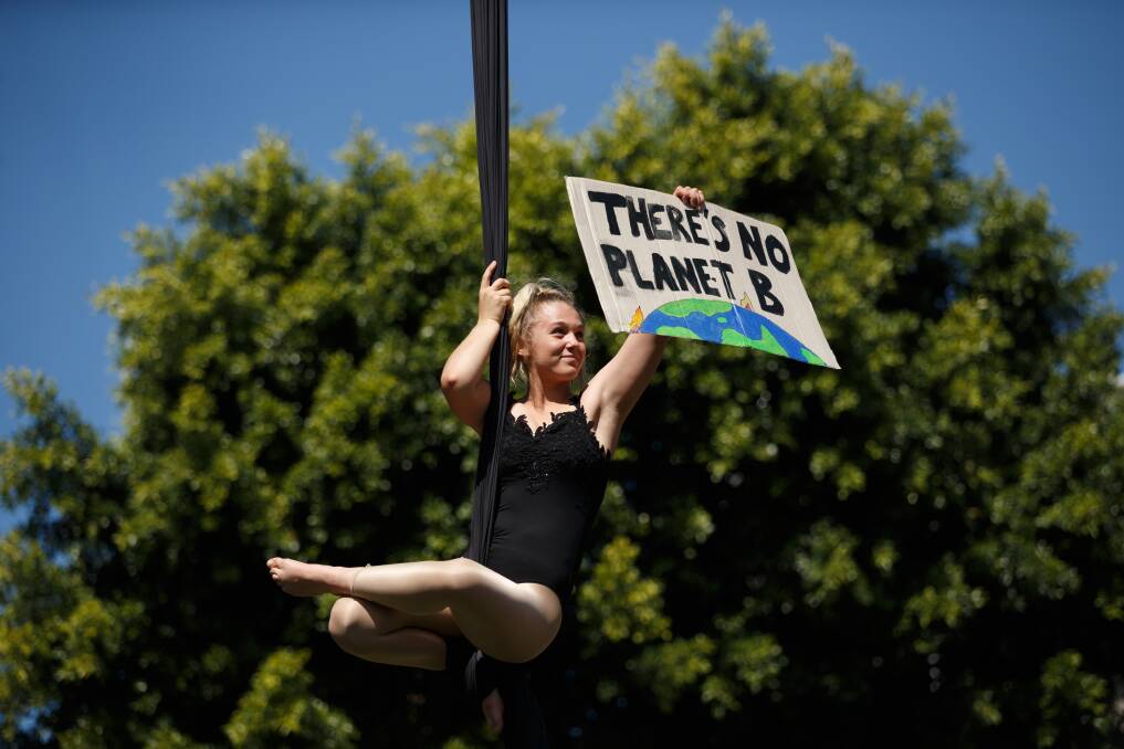 SENDING A MESSAGE: Amy-Lea Mahony from Circus Avalon performing on a silk at Civic Park during the Students Strike 4 Climate event. Pictures: Max Mason-Hubers 