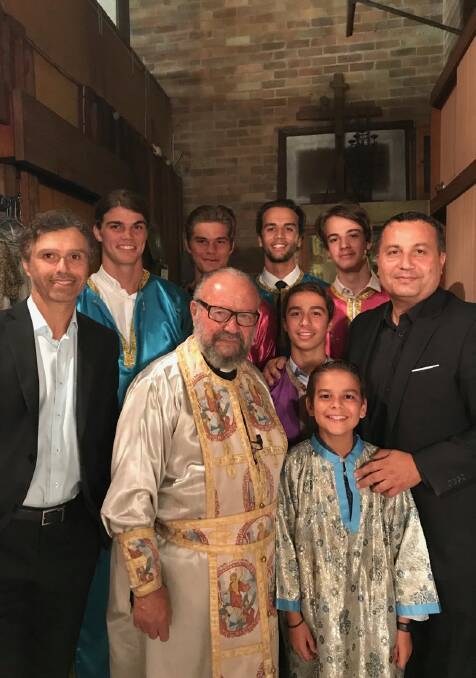 FAMILY: Father Nicolaos Zervas OAM surrounded by his family during Greek Easter.