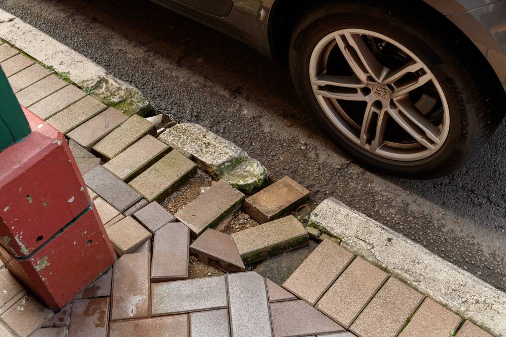 NEEDS WORK: Loose pavers on Beaumont Street. The brown paving contributes to what traders say is a "tired" and "dirty" looking streetscape. Picture: Max Mason-Hubers