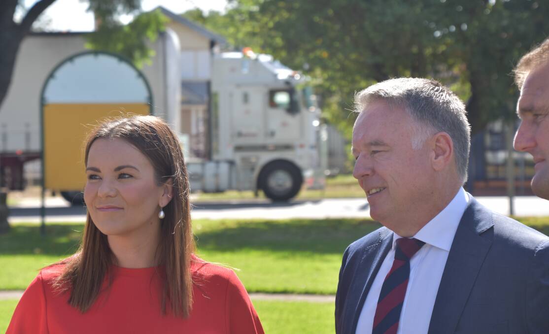 FUNDING: Melanie Dagg and Joel Fitzgibbon at Burdekin Park with one of the many hundreds of trucks that pass along George Street (New England Highway) each day.