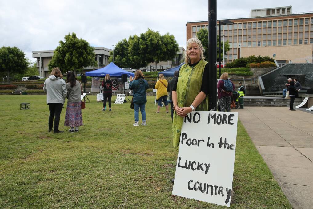 CALL FOR ACTION: Newcastle Poverty Action Alliance chair Kelly Hansen at the protest in Civic Park on Sunday. Picture: Max Mason-Hubers