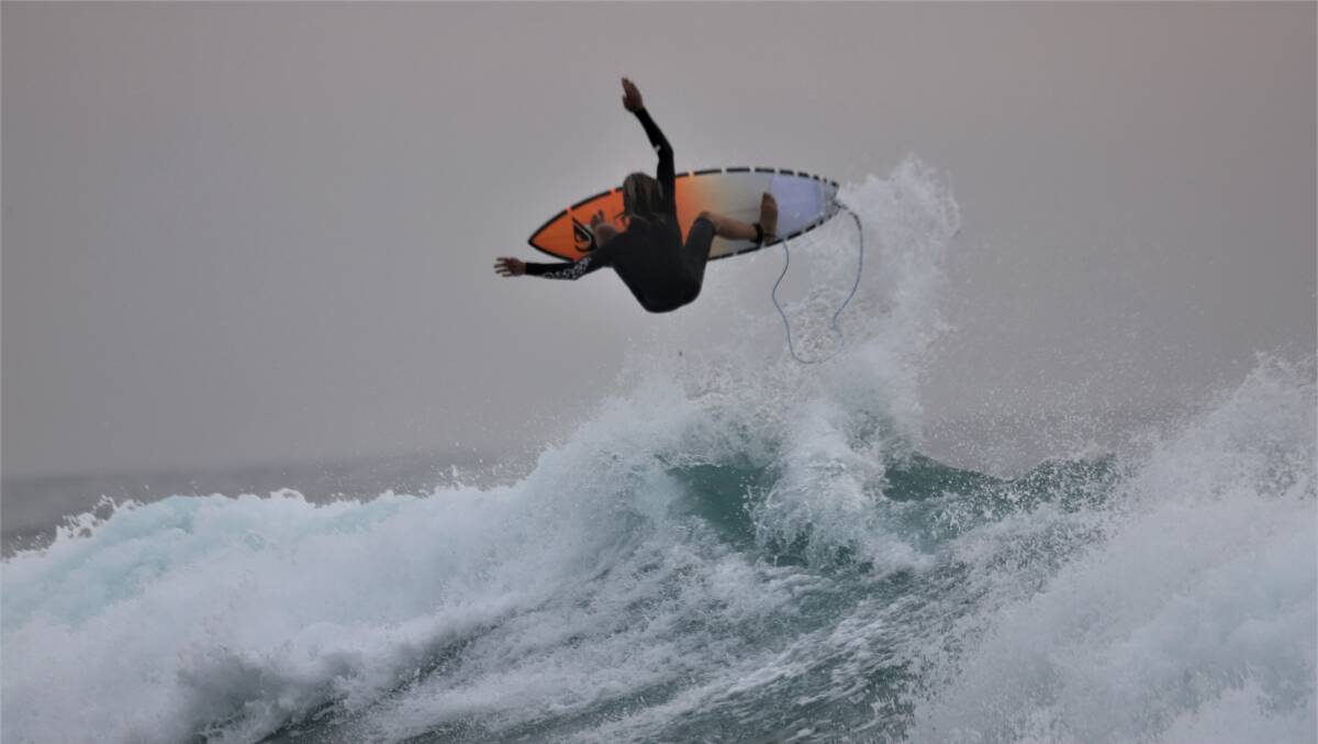 HANG TIME: Sunny Whitby-Otto ripping in at Merewether. Picture: Dave Anderson