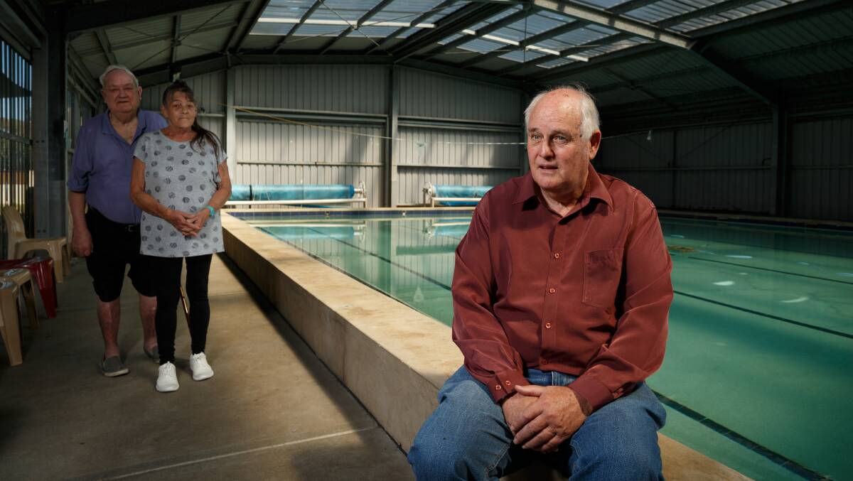 FEARING THE END: Valentine Hydrotherapy Pools secretary John McGrath with president Jack Baldwin and volunteer Leanne Harvey. Picture: Max Mason-Hubers