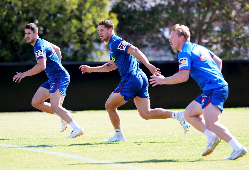 Kalyn Ponga, centre, with Lachlan Miller, right, at training. Picture by Peter Lorimer 