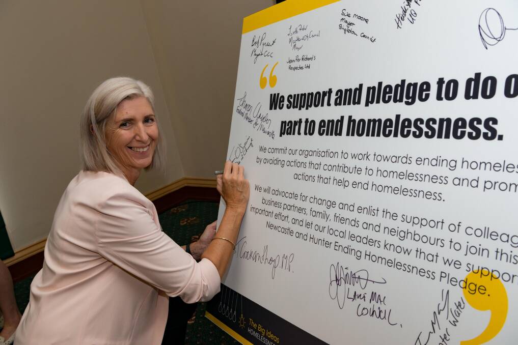 COMMITMENT: Jenn O’Sullivan, Path2Change executive manager, signs her organisation's pledge. Picture: Justin Worboys Photography.