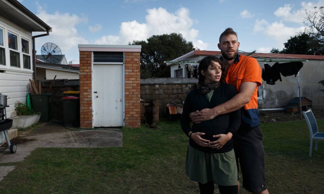 DISMAYED: Melina Vargas and Steve Denshire at their Hamilton home where the backyard toilet roof was replaced. The old roof contained asbestos and Mr Denshire believes it was not removed appropriately. Picture: Max Mason-Hubers 