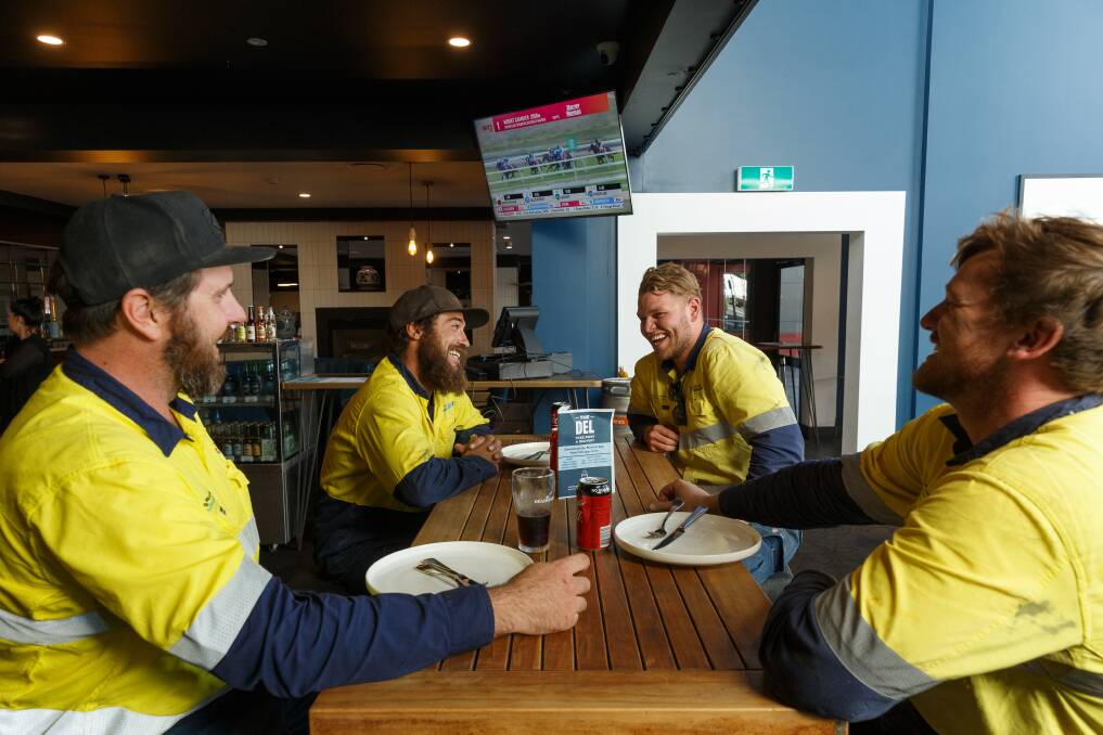 ALL DONE: City of Newcastle workers Daniel Page, Jared Stanton, Zac Ansell and Ryan Bruce after their first post-lockdown pub feed at the Delany Hotel at lunchtime on Friday. Picture: Max Mason-Hubers 