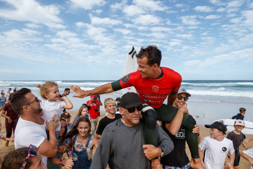 CELEBRATION: Julian Wilson after winning Surfest last year. The adopted Novocastrian would feature if Newcastle hosts a Championship Tour round. Picture: Max Mason-Hubers