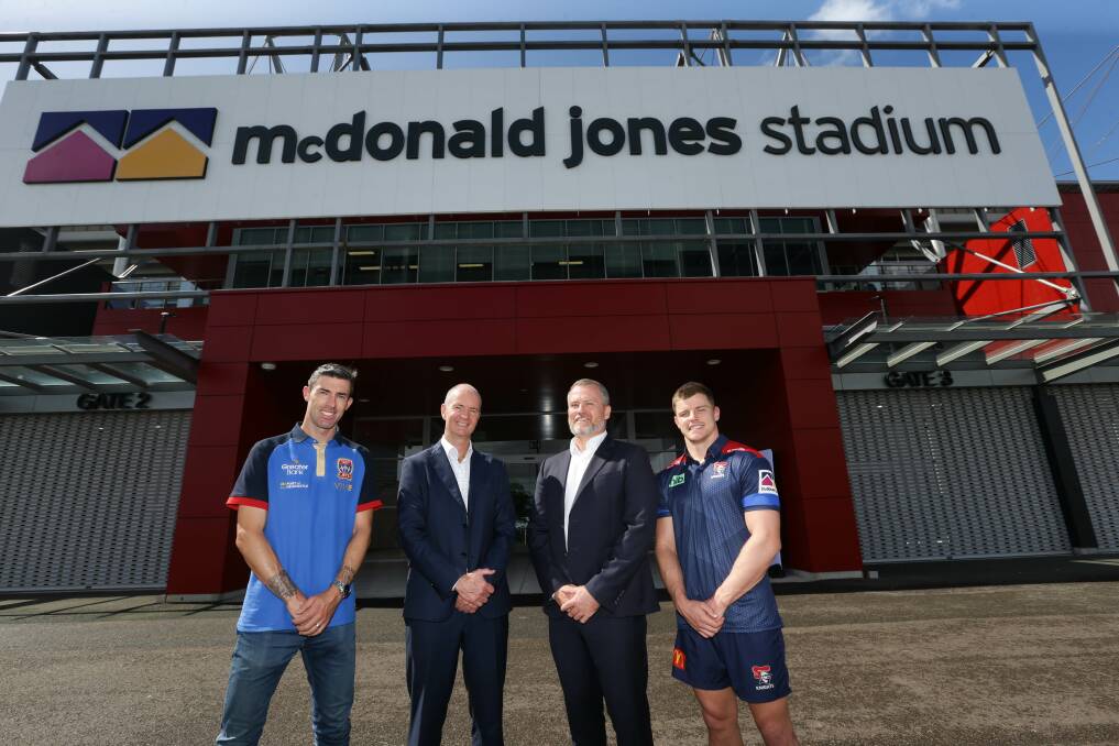 LONG-TERM DEAL: Newcastle Jets defender Jason Hoffman, McDonald Jones Homes CEO Cameron Lade, stadium manager Dean Mantle and Knights club captain Jayden Brailey outside the venue on Tuesday. Picture: Jonathan Carroll 