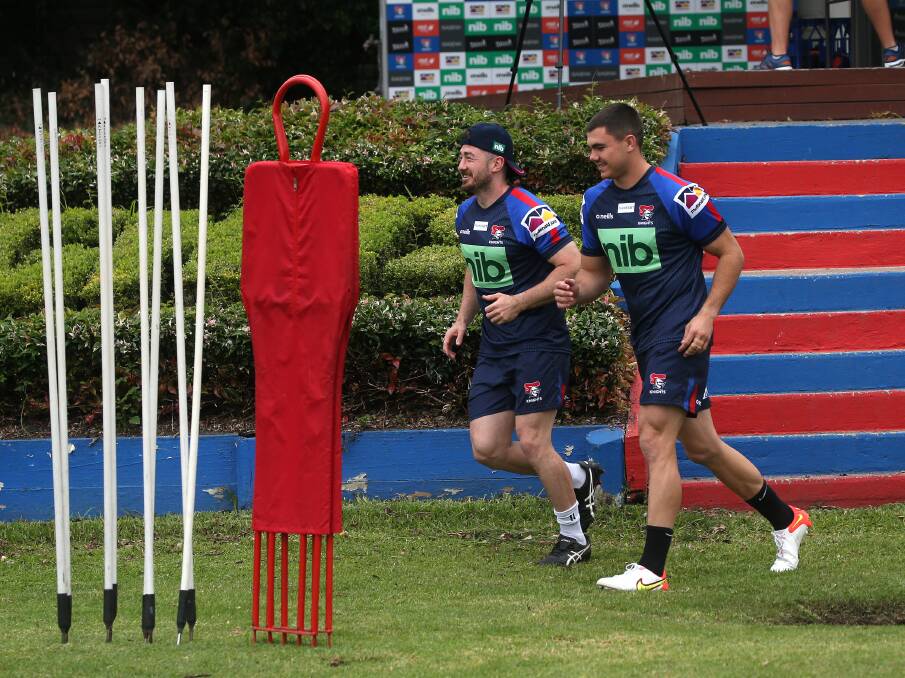 ONE BACK, ONE NOT: Knights playmakers Adam Clune, left, and Jake Clifford, right, at training earlier this year. Clune has been named to return aginst the Bulldogs on Friday, while Clifford was left out of the side. Picture: Peter Lorimer