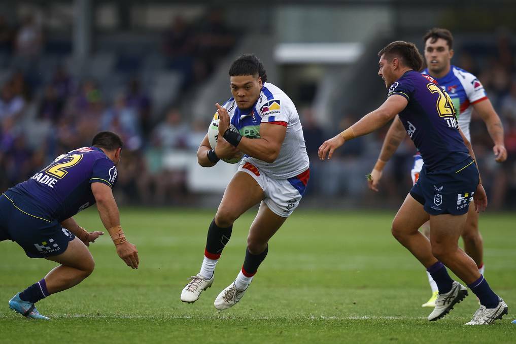 THROUGH THE MIDDLE: Newcastle Knights forward Leo Thompson takes a run against Melbourne in a pre-season trial match. Picture: Getty Images 