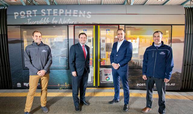PROMOTION: Andrew Macdonald, Minister Stuart Ayres, Destination NSW CEO Steve Cox and mayor Ryan Palmer in front a Sydney tram wrapped in campaign advertising.