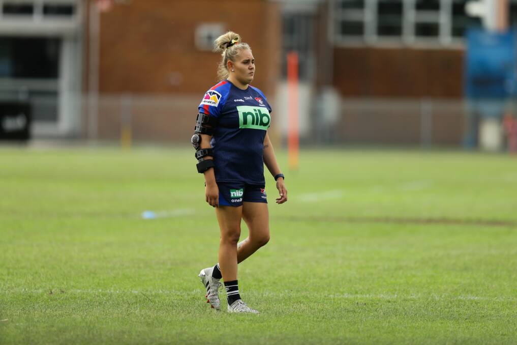 SIDELINED: Caitlan Johnston at Knights training wearing an elbow brace earlier this year. Picture: Jonathan Carroll 