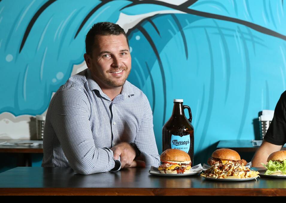 READY: Newy Burger Co owner Ben Neil, left, expects plenty of Novocastrians will use the vouchers over coming months. Picture: Marina Neil