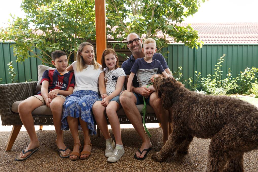 NEVER LEFT: Ethan, Angela, Olivia, Wesley & Lucas Wilson with dog Scooby. 