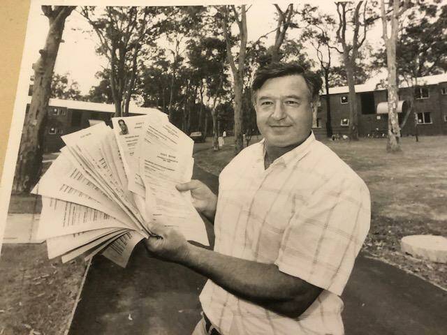 ON THE JOB: Bernie Curran sorting through applications for residency at Evatt House in 1990. Picture: John Herbert