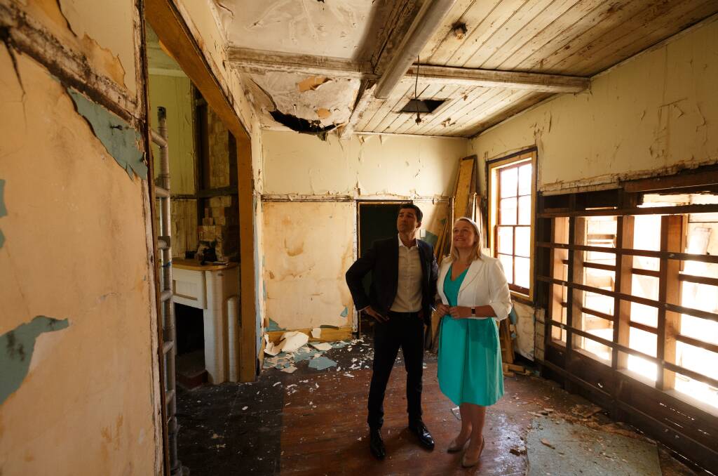 DAMAGE: Jeremy Bath and Nuatali Nelmes in the cottage in 2017. Picture: Max Mason-Hubers