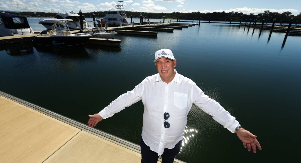 OPEN ARMS: Johnson Property Group chief executive Keith Johnson at the Trinity Point Marina on Thursday. Picture: Jonathan Carroll