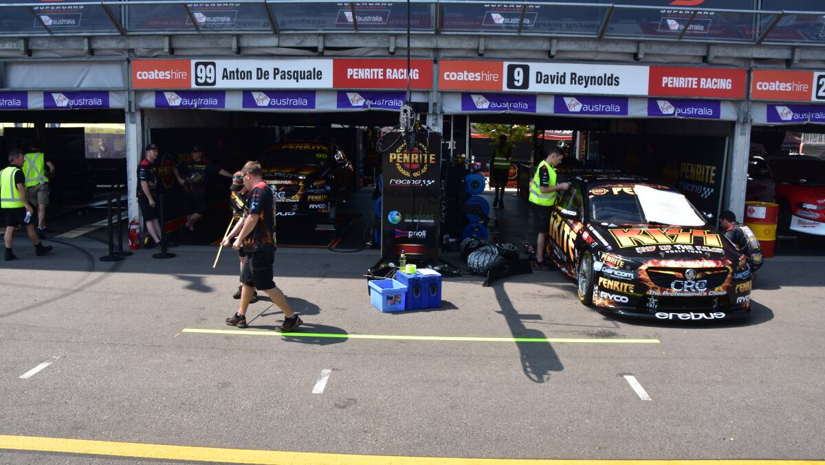 FINAL CHECKS: The team setting up their garage in Newcastle. 