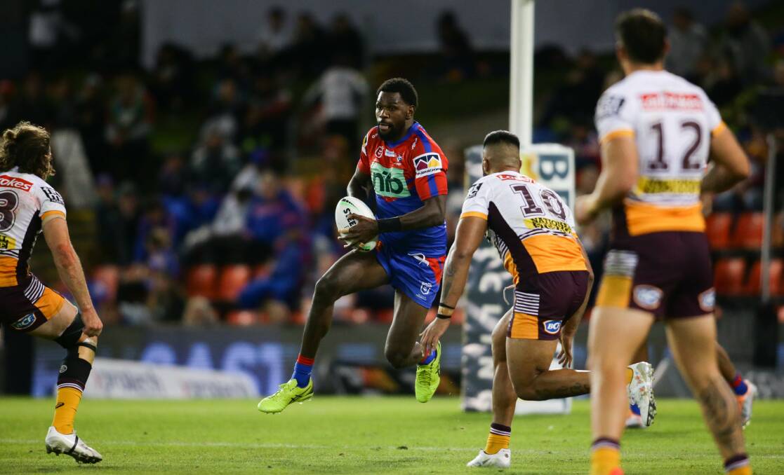 HIGH ENERGY: Newcastle Knights winger Edrick Lee carting the ball up against the Brisbane Broncos last week. Picture: Jonathan Carroll