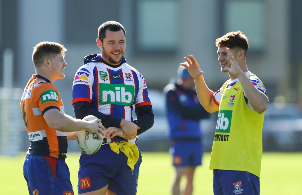 TRAINING CHIT-CHAT: Newcastle prop David Klemmer, centre, writes the future of teammate Kalyn Ponga, right, is not a distraction for the Knights despite three straight losses. 