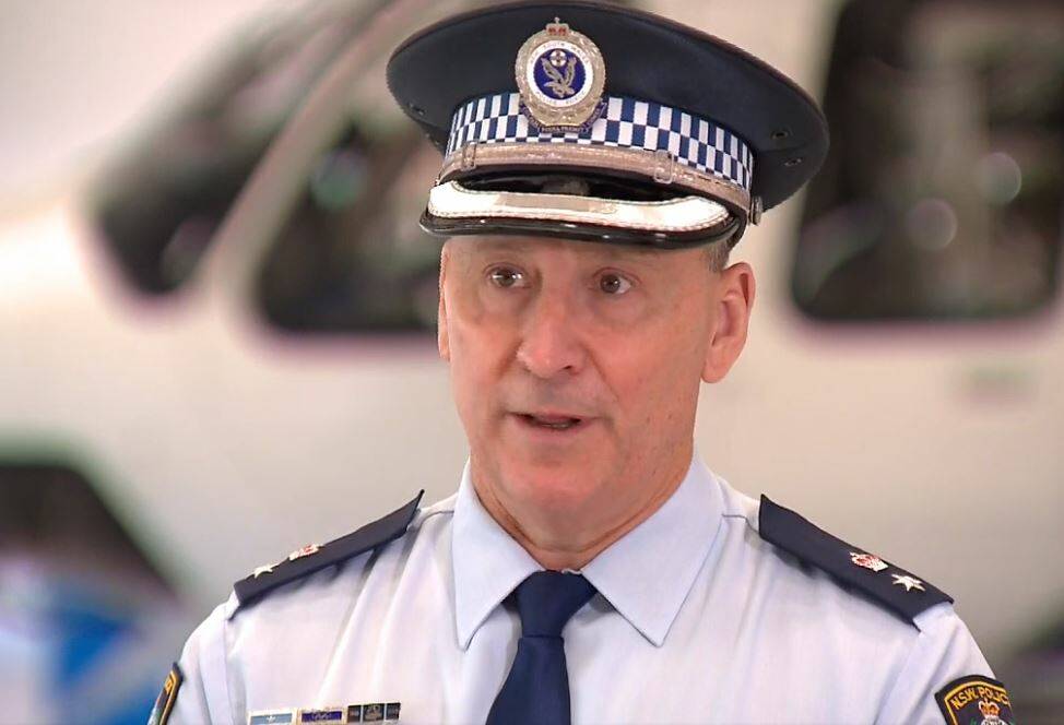 NSW Police Aviation Commander detective superintendent Brad Monk speaking to the media at Bankstown Airport on Tuesday. 