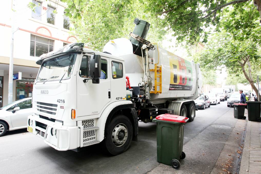 COULD BE ON THE WAY OUT: A diesel garbage truck collecting domestic garbage in Newcastle in 2011. The council hopes to transition its fleet to electric trucks. A business case is expected to be presented to councillors in May. 