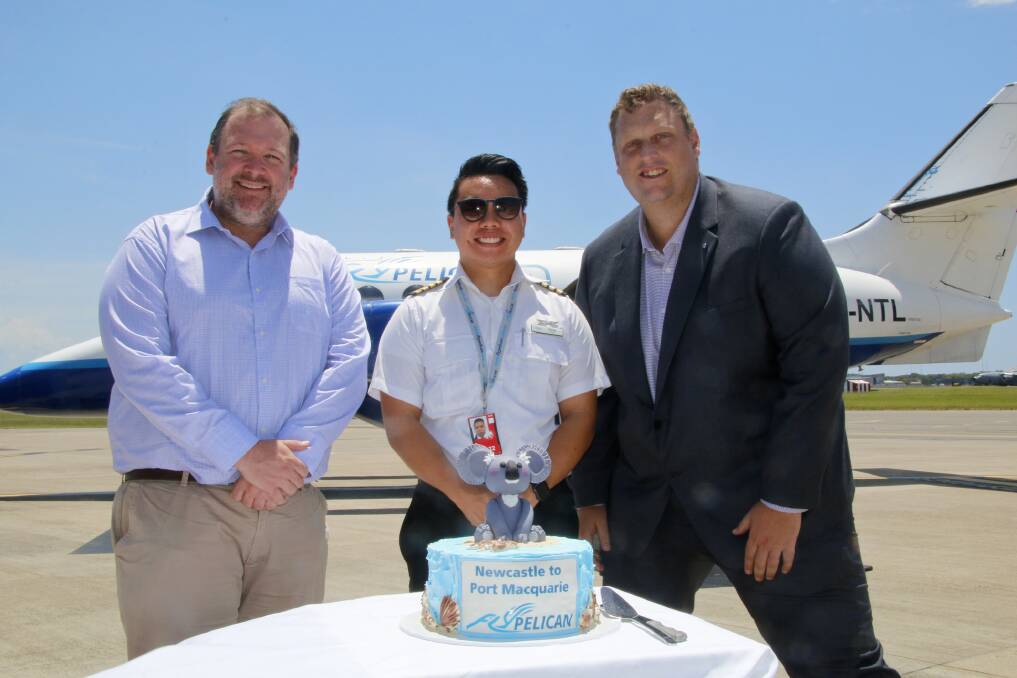 TAKE OFF:Newcastle Airport business development manager Matt Borger, Fly Pelican pilot Sai Ng and Fly Pelican CEO Marty Hawley on the tarmac on Thursday before the flight. 