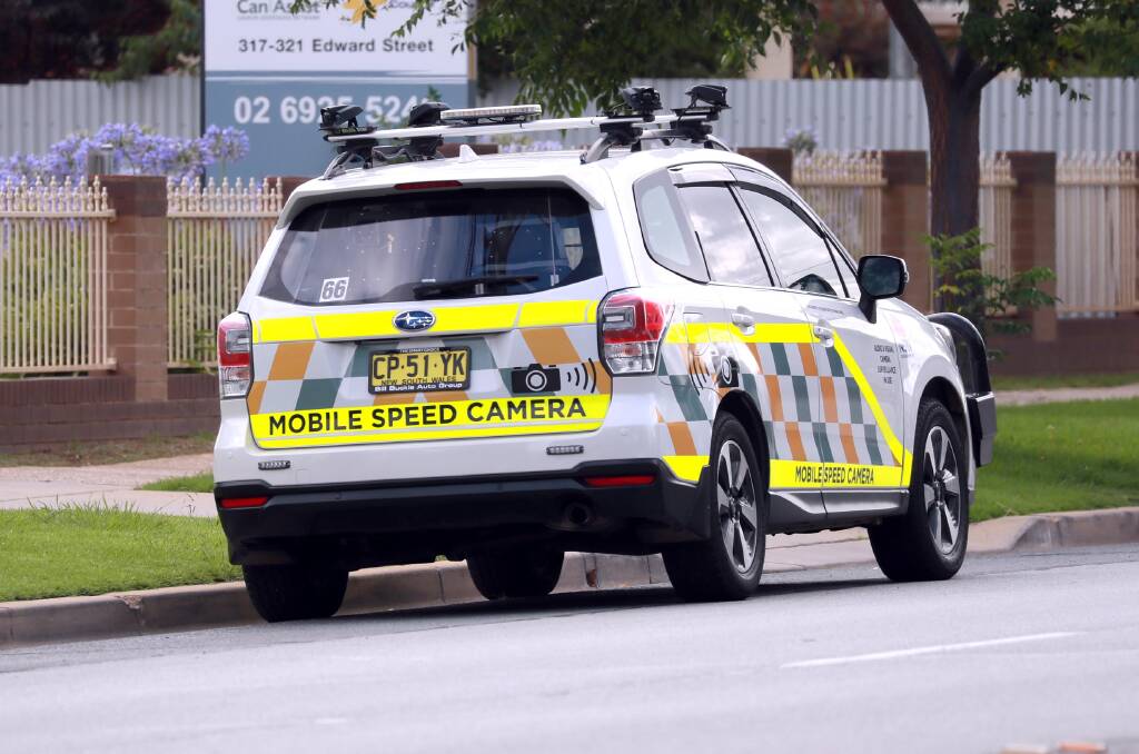 CHANGES: A mobile speed camera vehicle parked on the side of a suburban road. The 45 vehicles deployed statewide will soon have their high-visibility decals either reduced or removed. Picture: Les Smith 