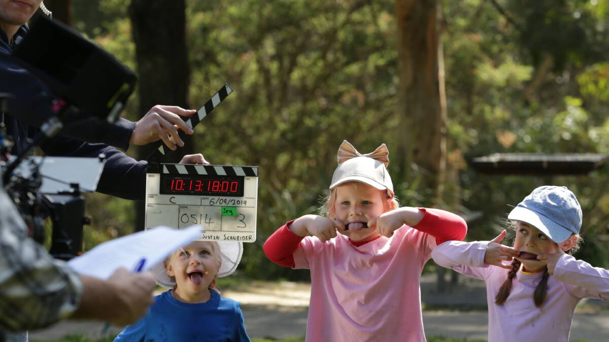 HAMMING IT UP: Newcastle children Georgia McManus, Rosie Anderson and Imogen Ciezak on set for I AM ME. More than 1000 local kids will feature in the new TV show being filmed entirely in Newcastle. Picture: Simone De Peak