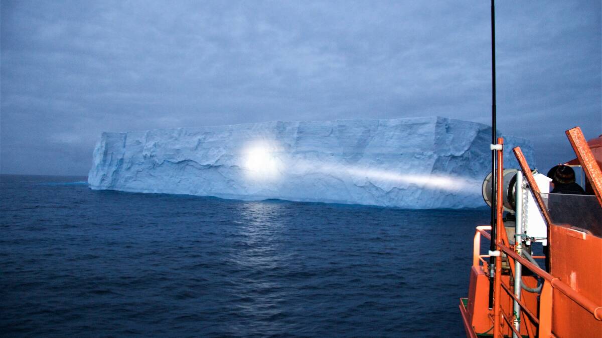 AA spotlight on iceberg. PHOTO: Brad Dennis AAD