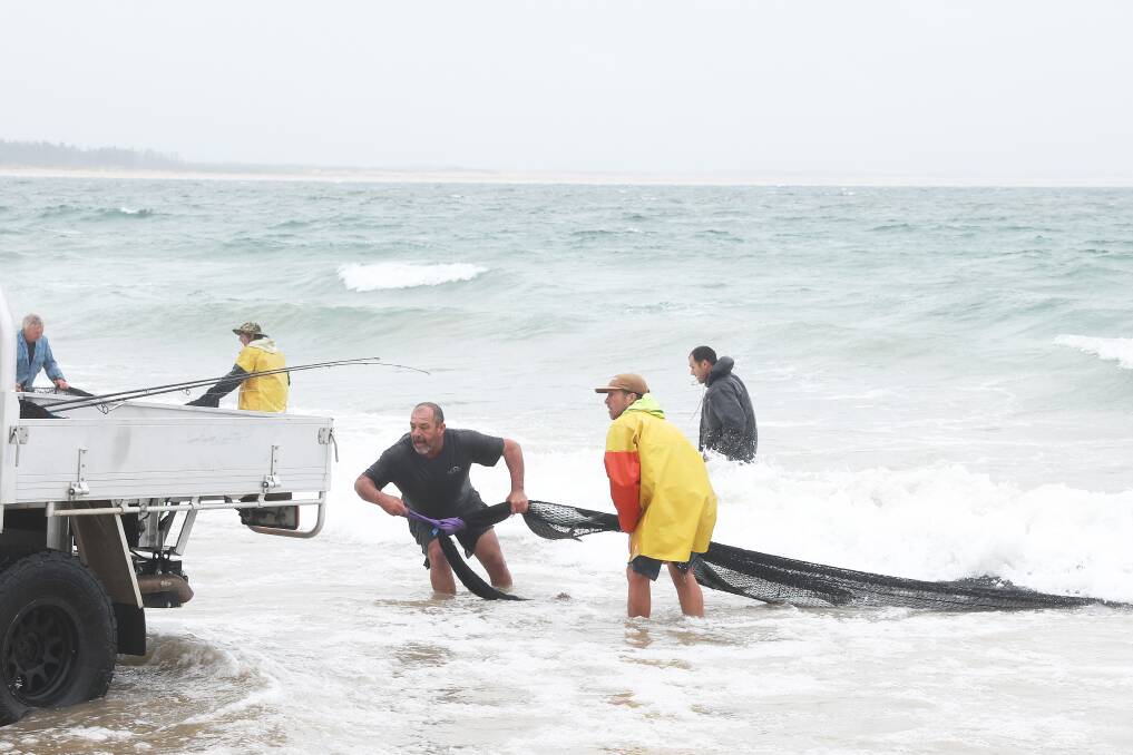 Commercial fisherman Greg Tarrant (centre) has questioned the practicality of a bycatch limit that he says has crippled his confidence to target mullet off Stockton Beach. Picture by Peter Lorimer